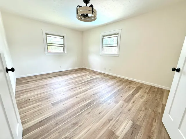 a bathroom with a shower and a sink