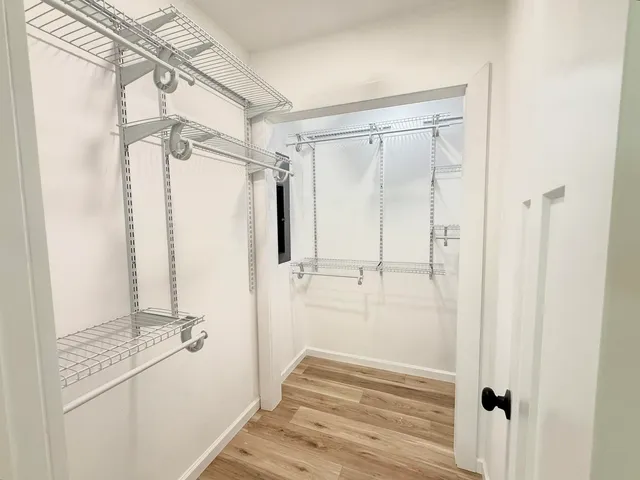 a view of empty room with ceiling fan