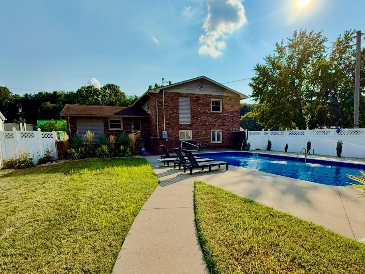 1103 West 10th Street Metropolis, IL 62960 - Photo 5 of 32 a view of a house with swimming pool and sitting area