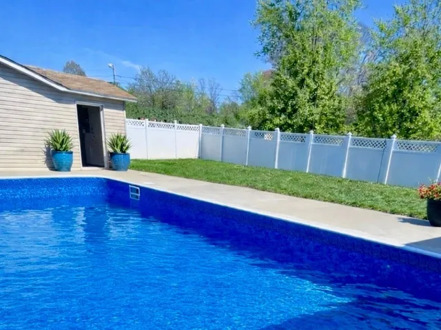 a view of a backyard with a small cabin