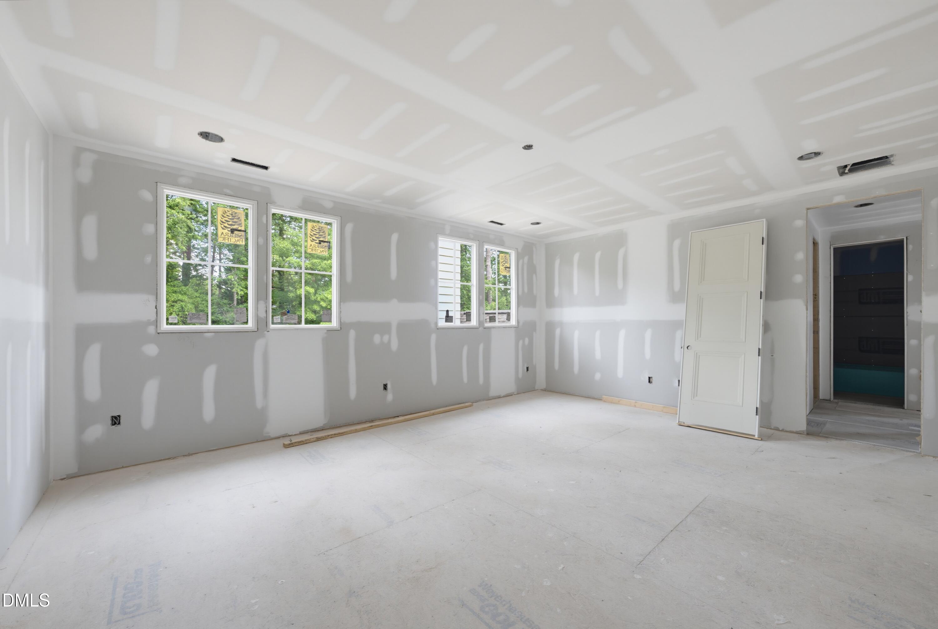 7508 Grist Mill Road Raleigh, NC 27615 - Photo 17 of 32 an empty room with windows and closet