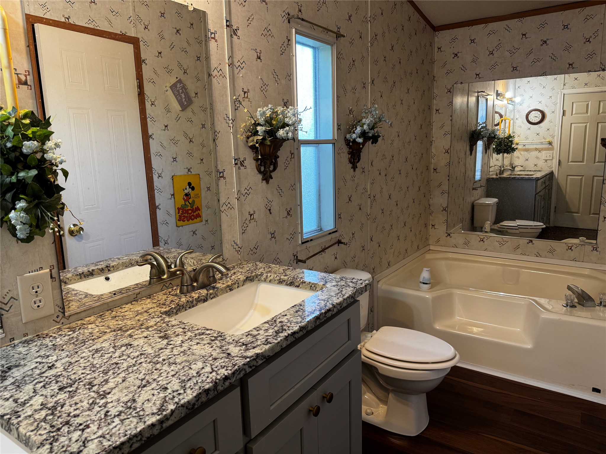 15930 Boss Gaston Road Sugar Land, TX 77498 - Photo 15 of 20 a bathroom with a granite countertop sink vanity mirror bathtub shower and a toilet