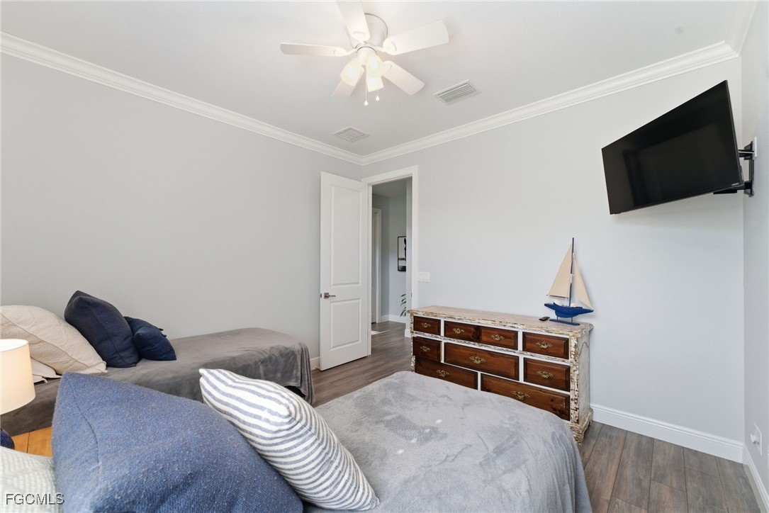 12304 Boat Shell Drive Matlacha Isles, FL 33991 - Photo 30 of 49 a bedroom with furniture and a flat screen tv