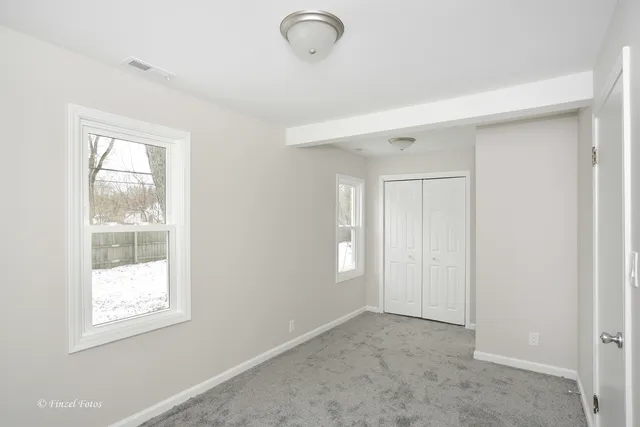 an empty room with windows