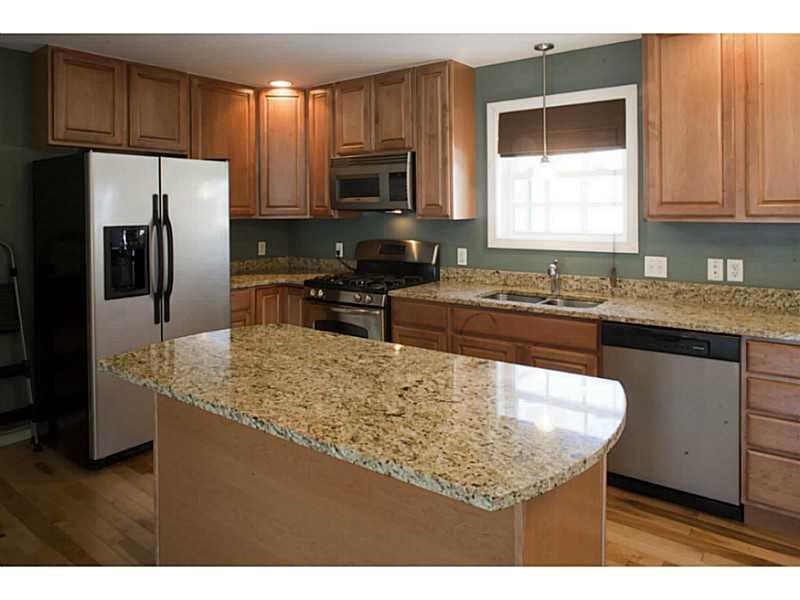 199 Bomarc Road, Unit 18 Bangor, ME 04401 - Photo 7 of 24 Kitchen. Kitchen island with...