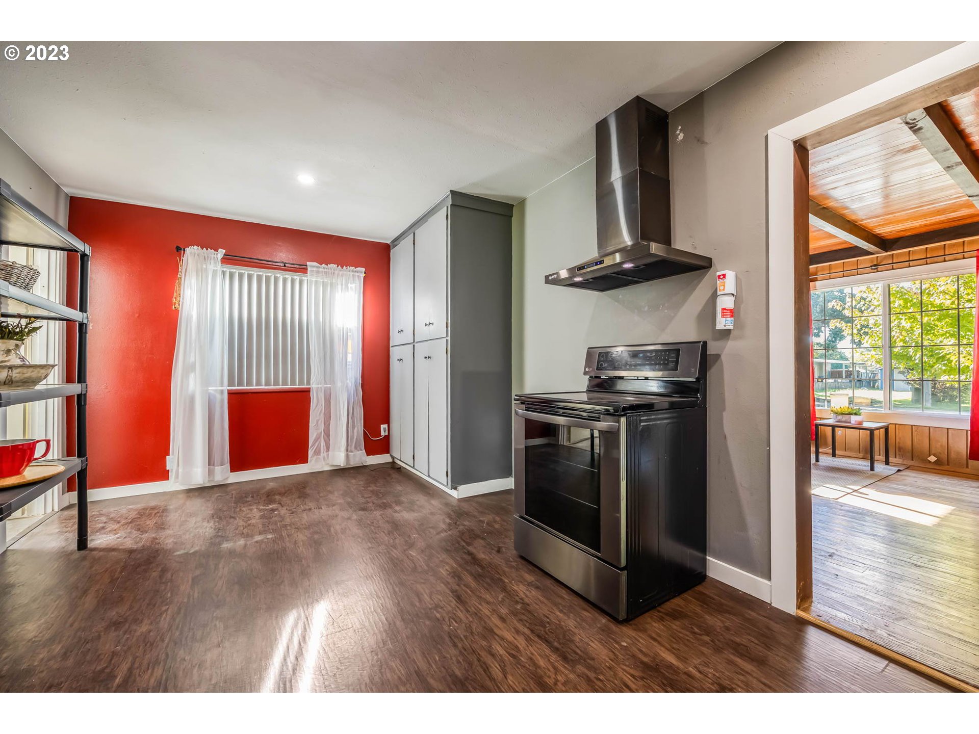 1565 Laura Street Springfield, OR 97477 - Photo 12 of 40 a kitchen with stainless steel appliances granite countertop a refrigerator and a stove top oven