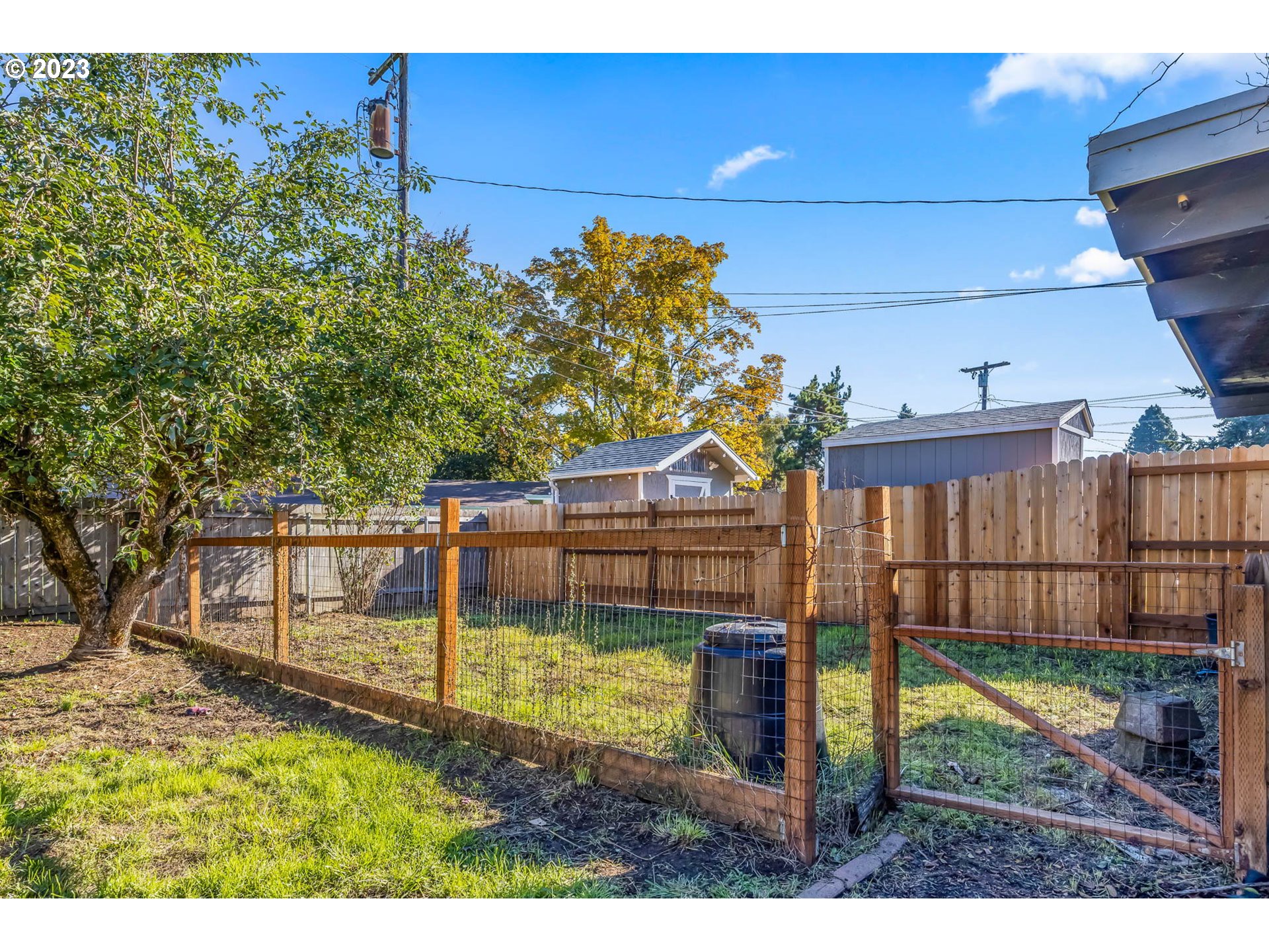 1565 Laura Street Springfield, OR 97477 - Photo 39 of 40 a view of a backyard with wooden fence