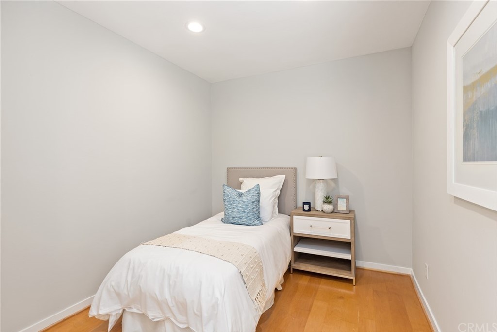 708 Cliff Drive Laguna Beach, CA 92651 - Photo 15 of 19 a bedroom with a bed and a window