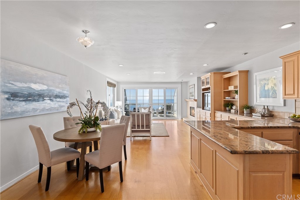 708 Cliff Drive Laguna Beach, CA 92651 - Photo 7 of 19 a dining hall with stainless steel appliances granite countertop a dining table and chairs