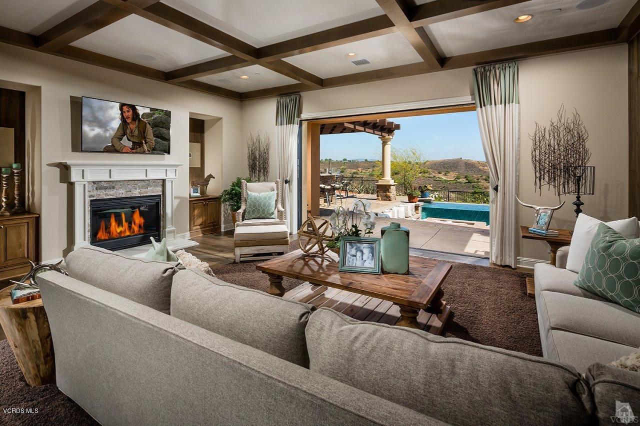 7334 Augusta Drive Moorpark, CA 93021 - Photo 3 of 13 a living room with furniture large window and a fireplace