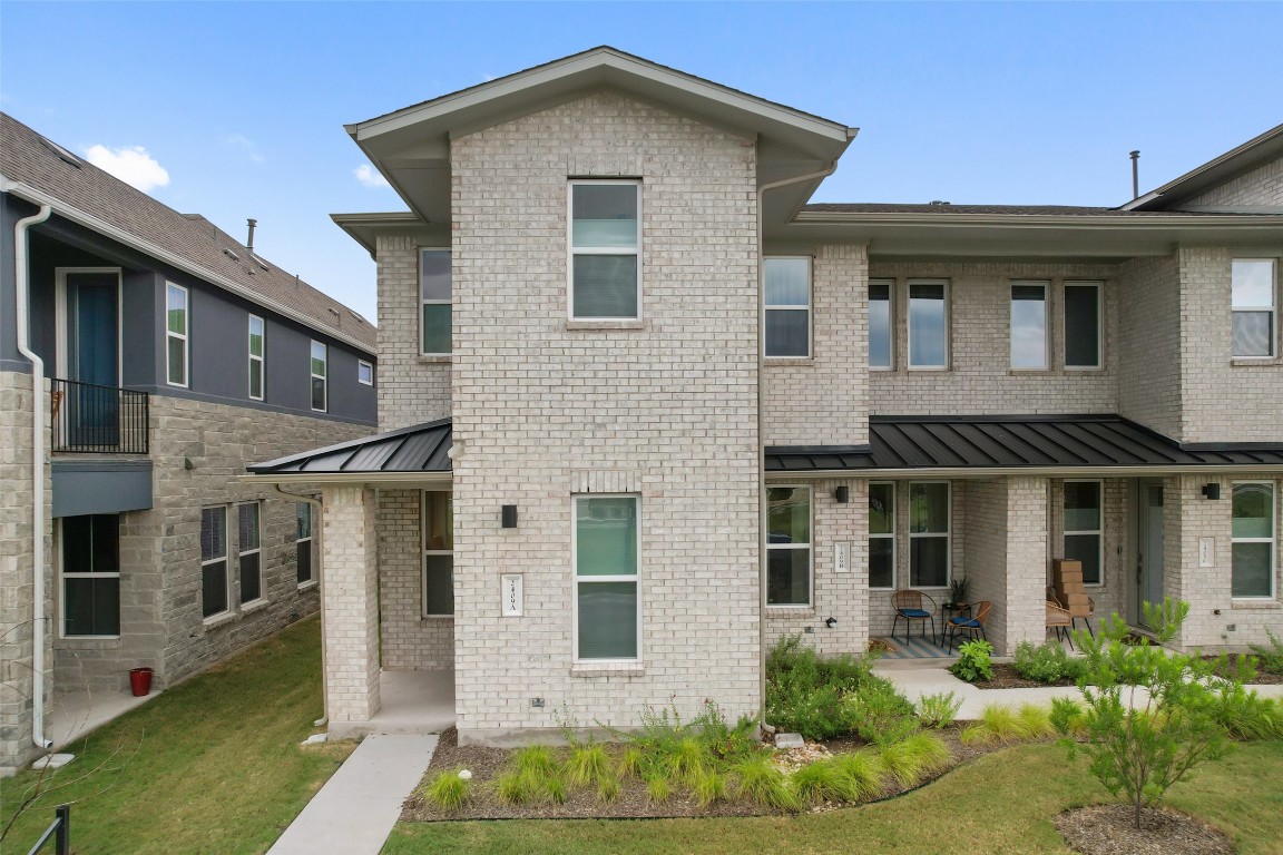 2409 Simond Avenue, Unit A Austin, TX 78723 - Photo 1 of 1 a front view of a house with garden