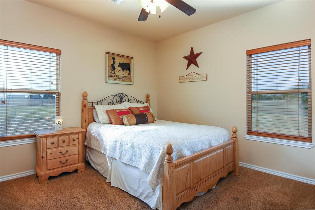 7158 Luella Road Sherman, TX 75090 - Photo 13 of 40 a bedroom with a bed and a window