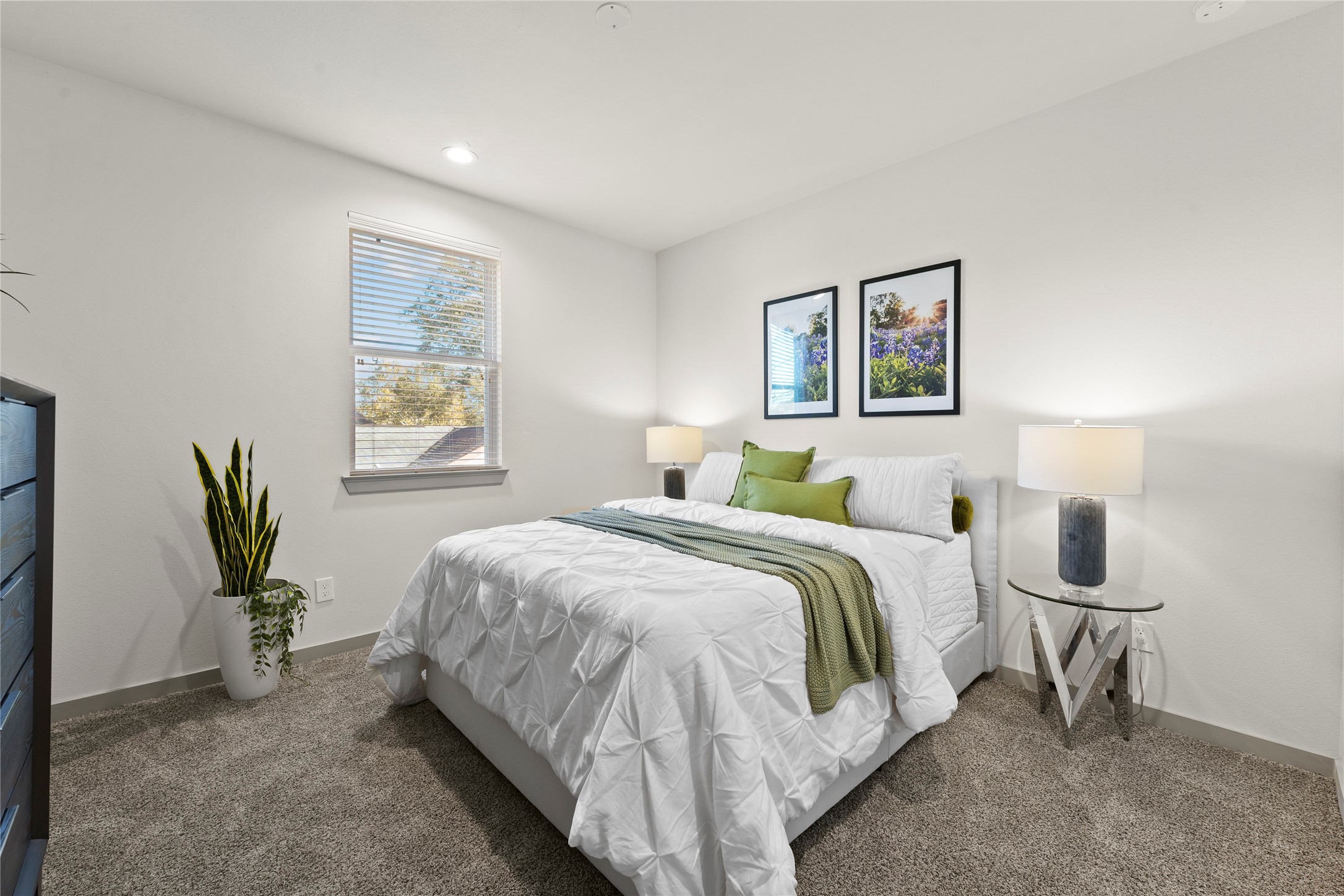 64 Dipping Lane Houston, TX 77076 - Photo 12 of 17 a spacious bedroom with a bed and a painting on the wall