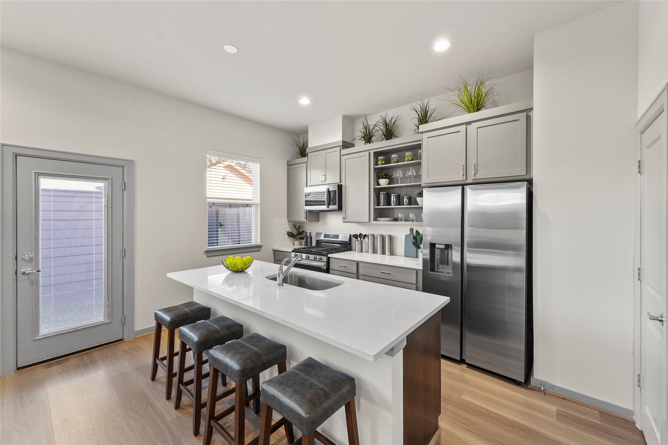 64 Dipping Lane Houston, TX 77076 - Photo 5 of 17 a kitchen with refrigerator and chairs