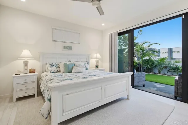 a spacious bedroom with a bed and a window