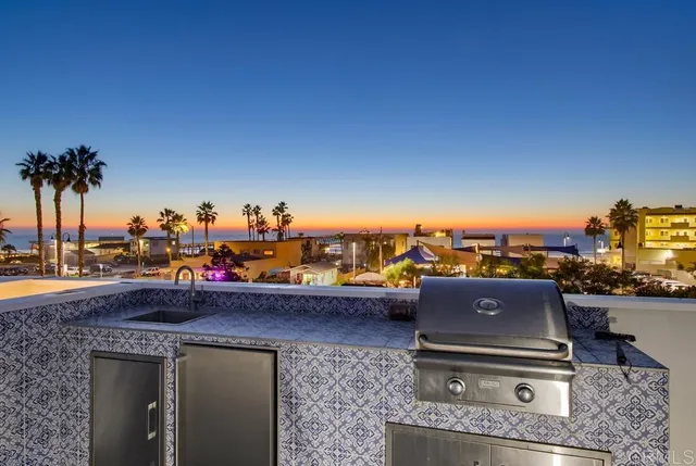 a view of a terrace with a table and chairs