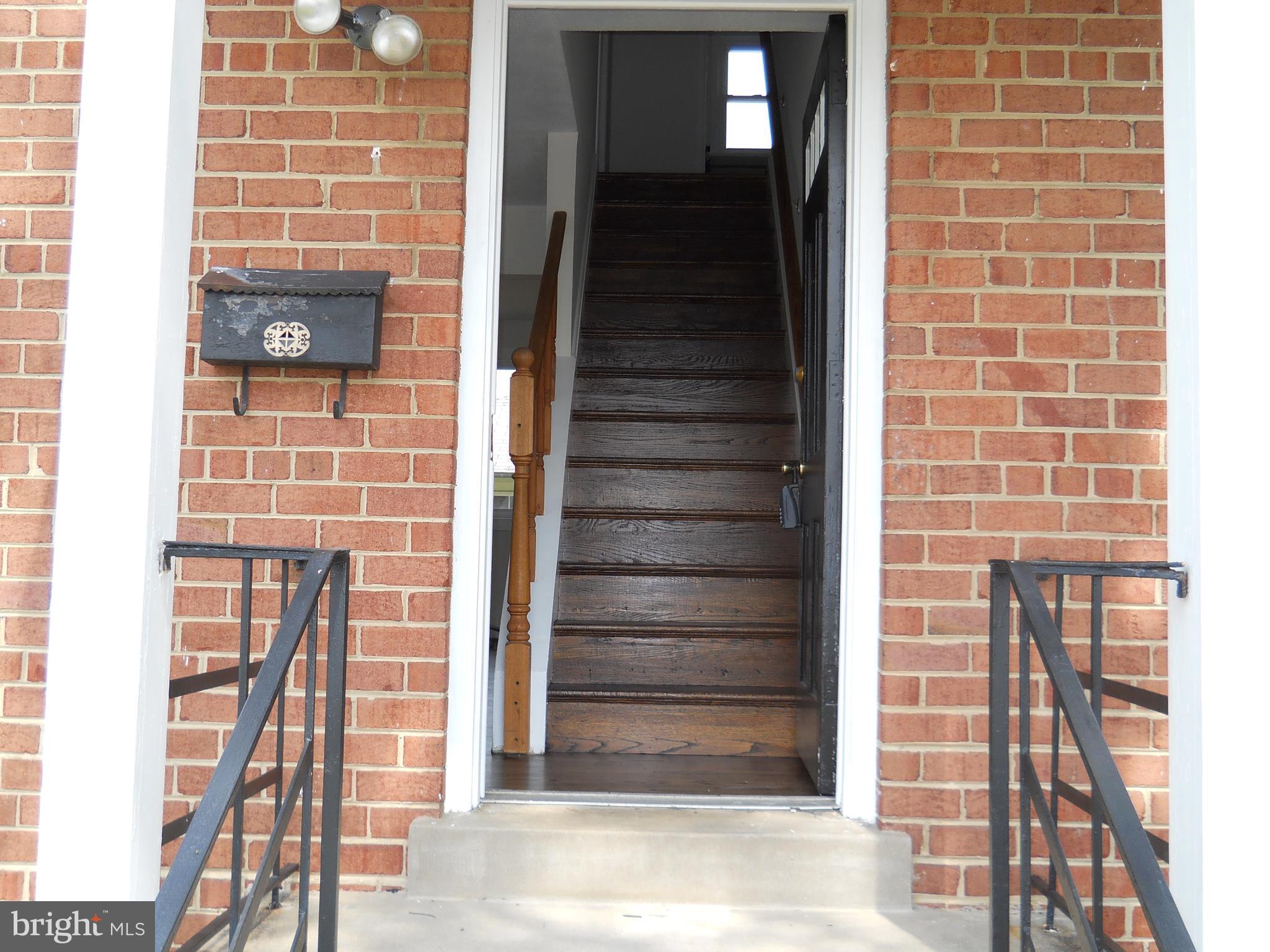 12607 Dean Road Silver Spring, MD 20906 - Photo 2 of 34 a view of door with wooden door