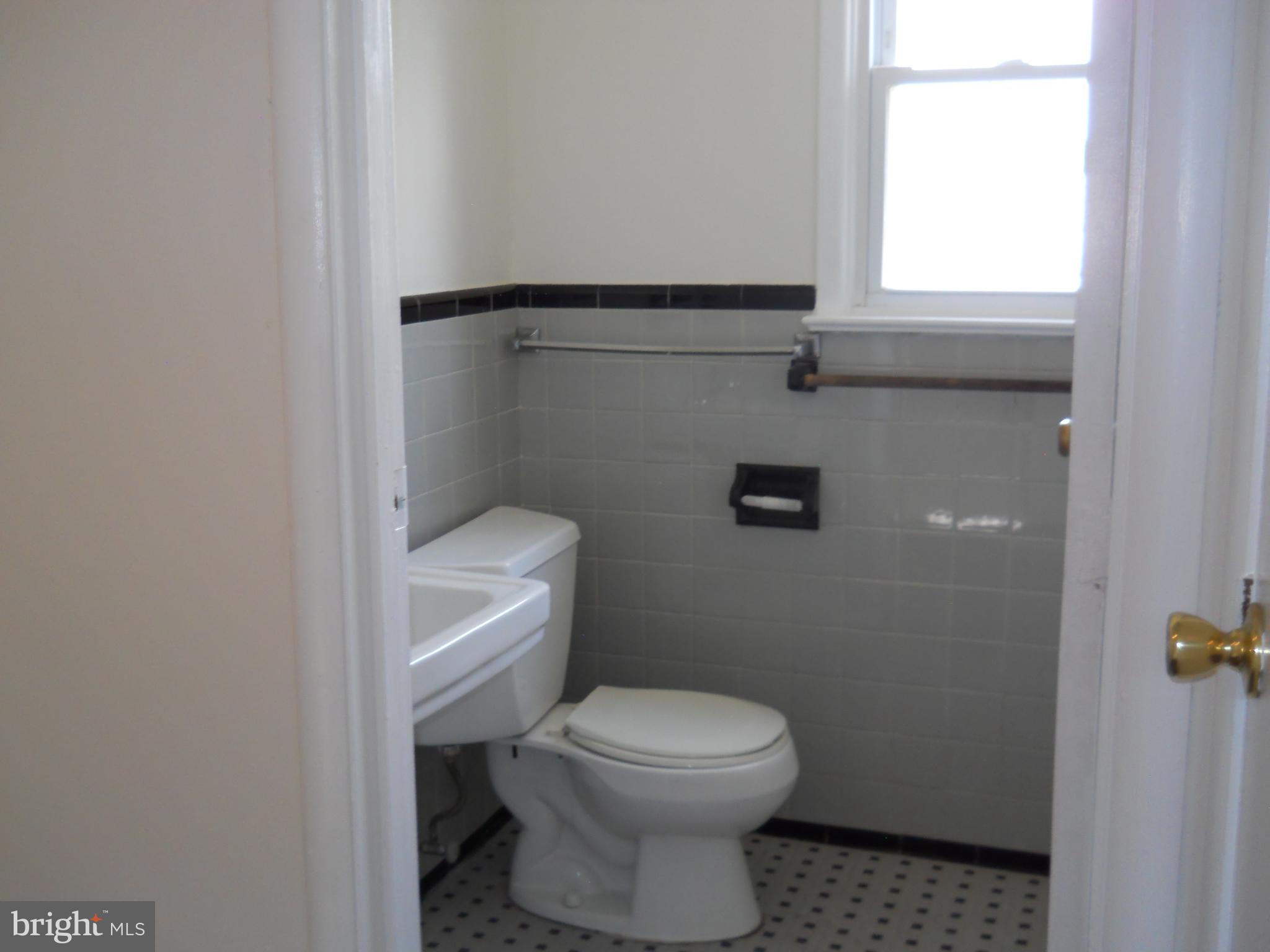 12607 Dean Road Silver Spring, MD 20906 - Photo 19 of 34 a bathroom with a toilet