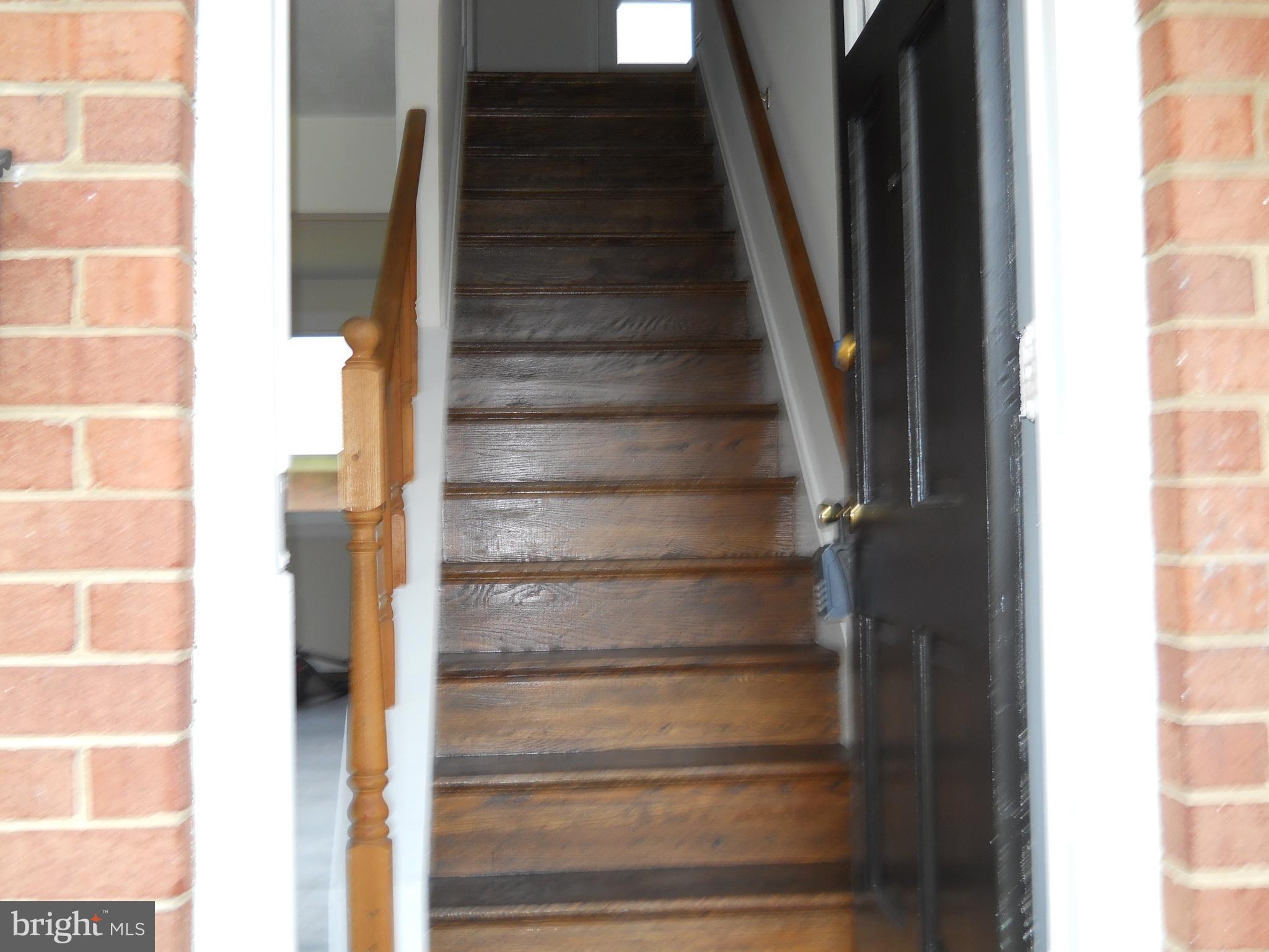 12607 Dean Road Silver Spring, MD 20906 - Photo 3 of 34 a view of staircase with white walls and windows