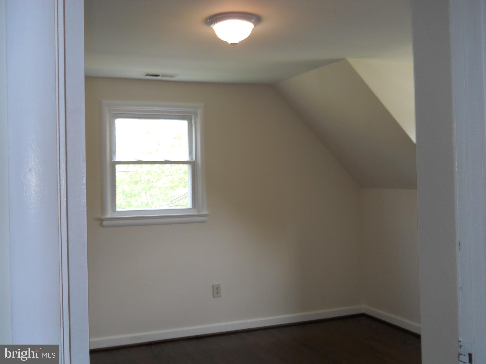 12607 Dean Road Silver Spring, MD 20906 - Photo 23 of 34 an empty room with a window