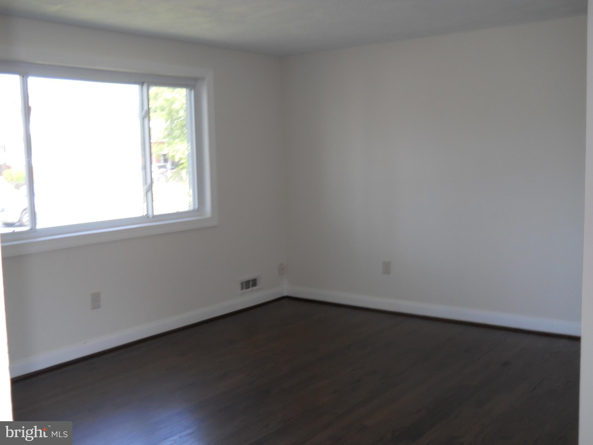 12607 Dean Road Silver Spring, MD 20906 - Photo 5 of 34 an empty room with a window