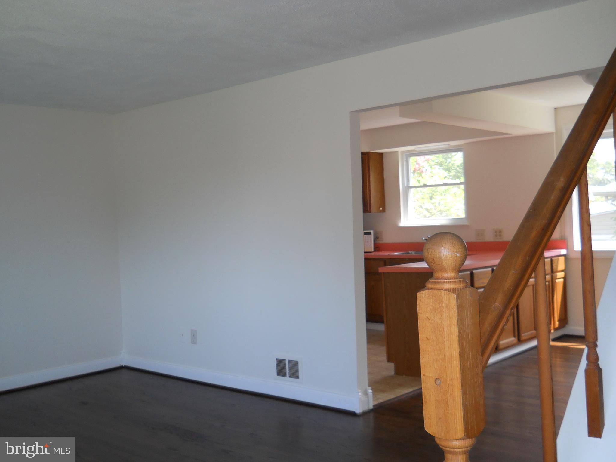 12607 Dean Road Silver Spring, MD 20906 - Photo 6 of 34 a view of entryway with wooden floor