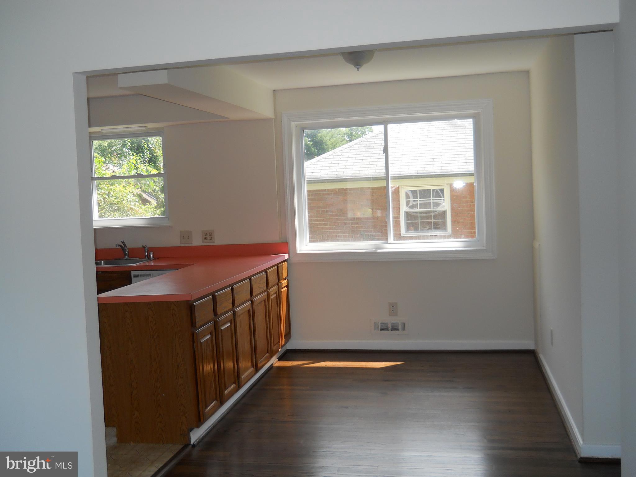 12607 Dean Road Silver Spring, MD 20906 - Photo 7 of 34 an empty room with a window
