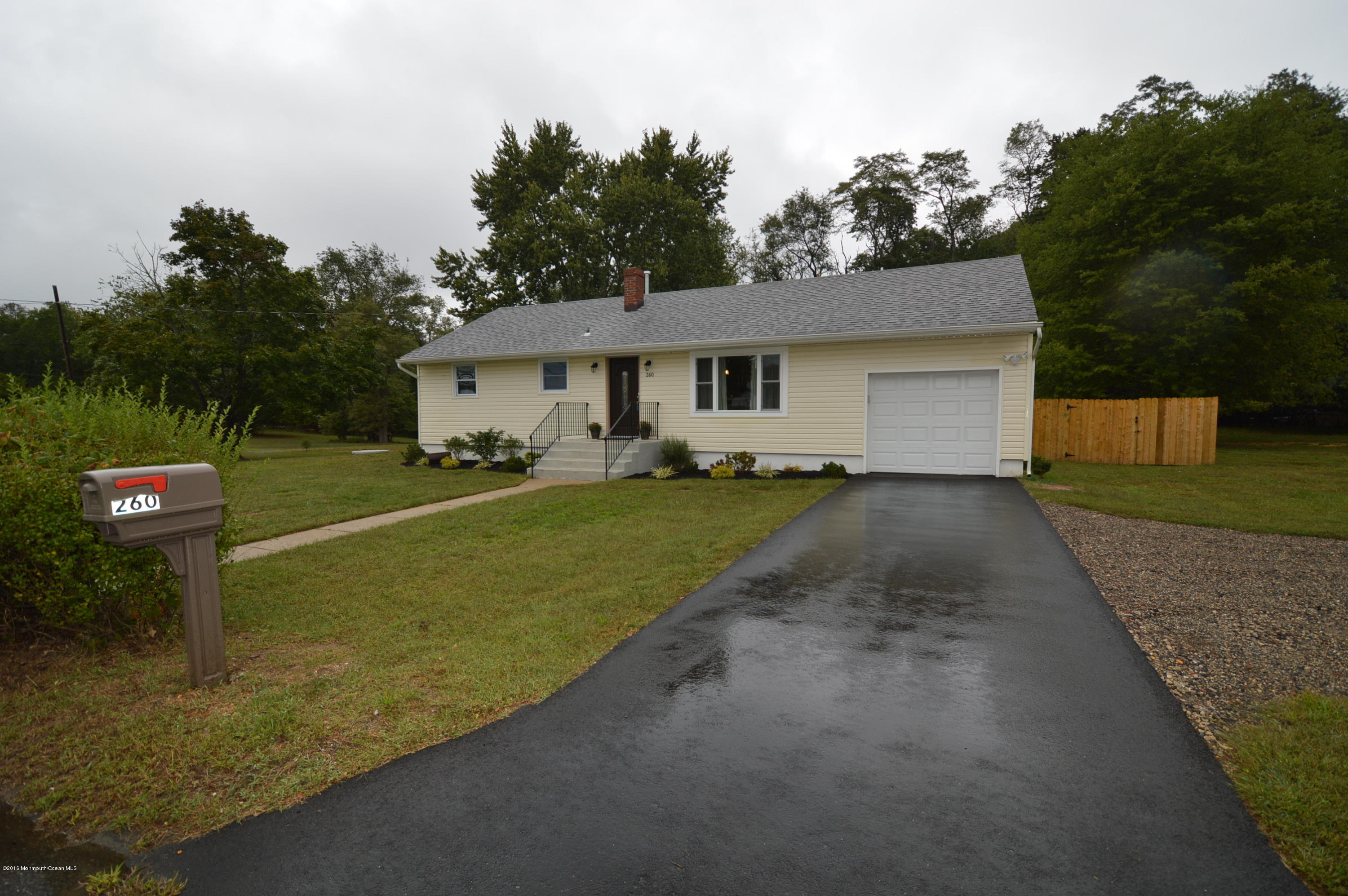 260 Adelphia Road Farmingdale, NJ 07727 - Photo 2 of 30 a front view of a house with a yard