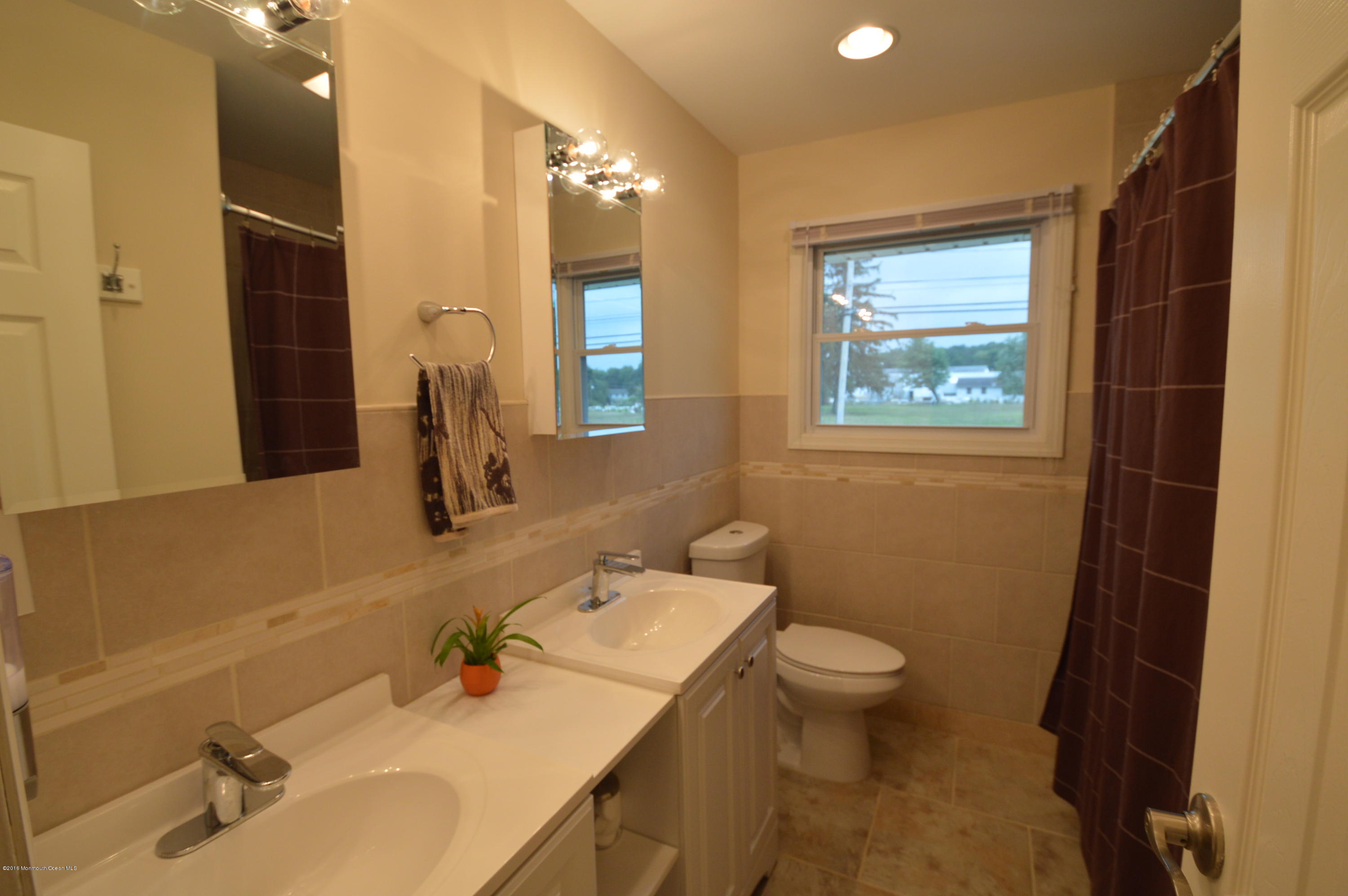 260 Adelphia Road Farmingdale, NJ 07727 - Photo 16 of 30 a bathroom with a sink toilet and shower