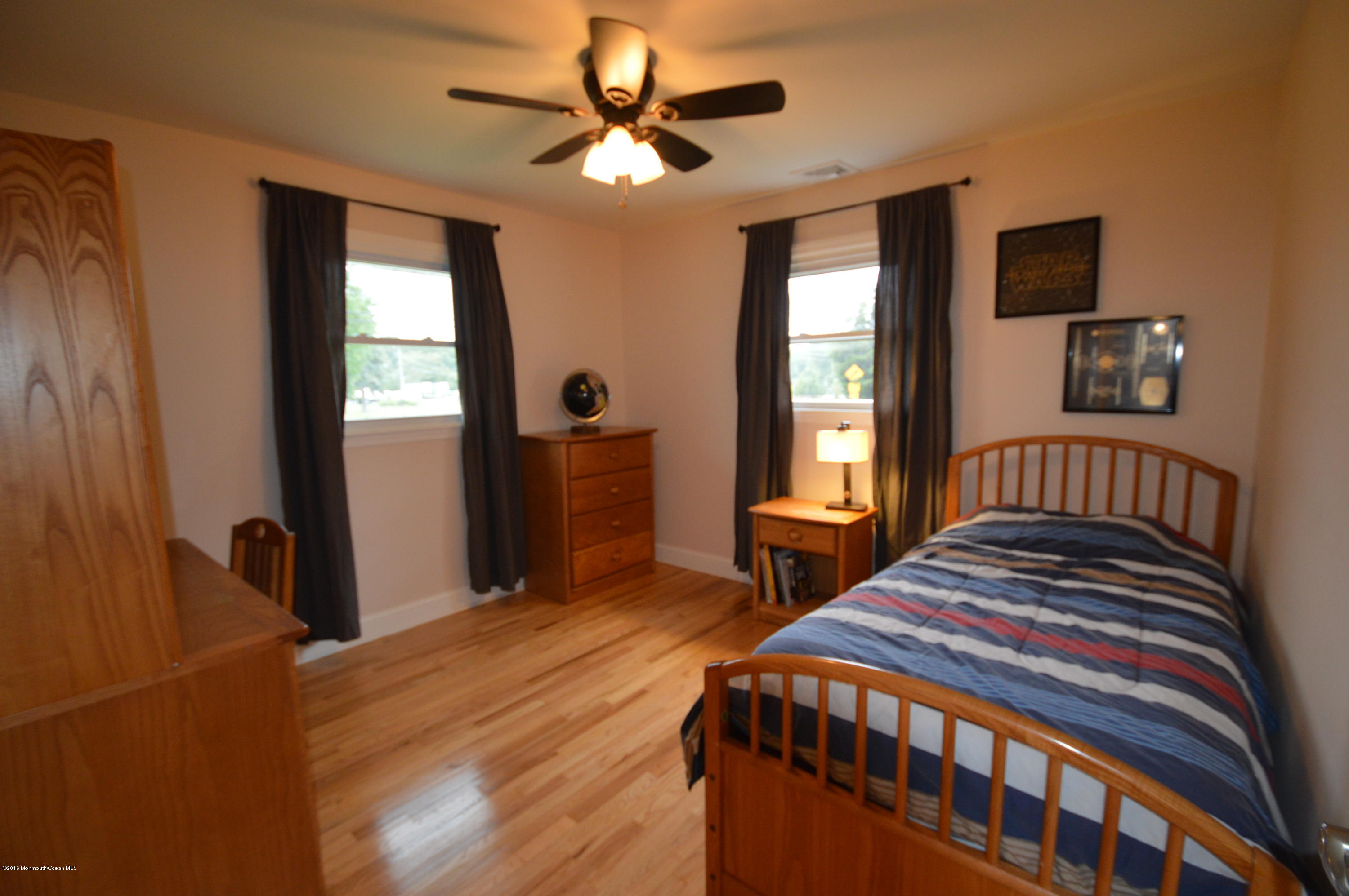 260 Adelphia Road Farmingdale, NJ 07727 - Photo 18 of 30 a bedroom with a bed and a window