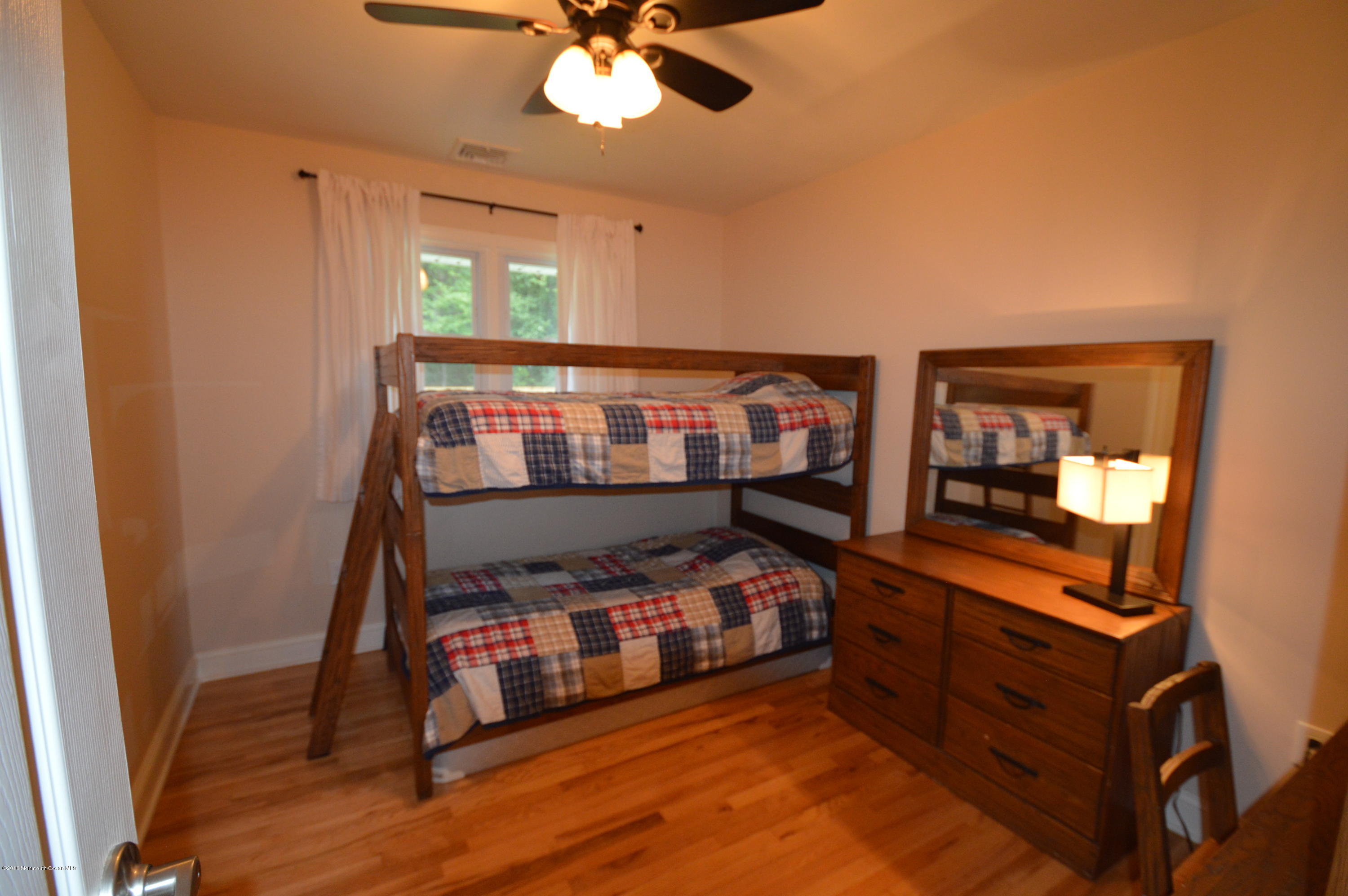 260 Adelphia Road Farmingdale, NJ 07727 - Photo 19 of 30 a bedroom with furniture and a window