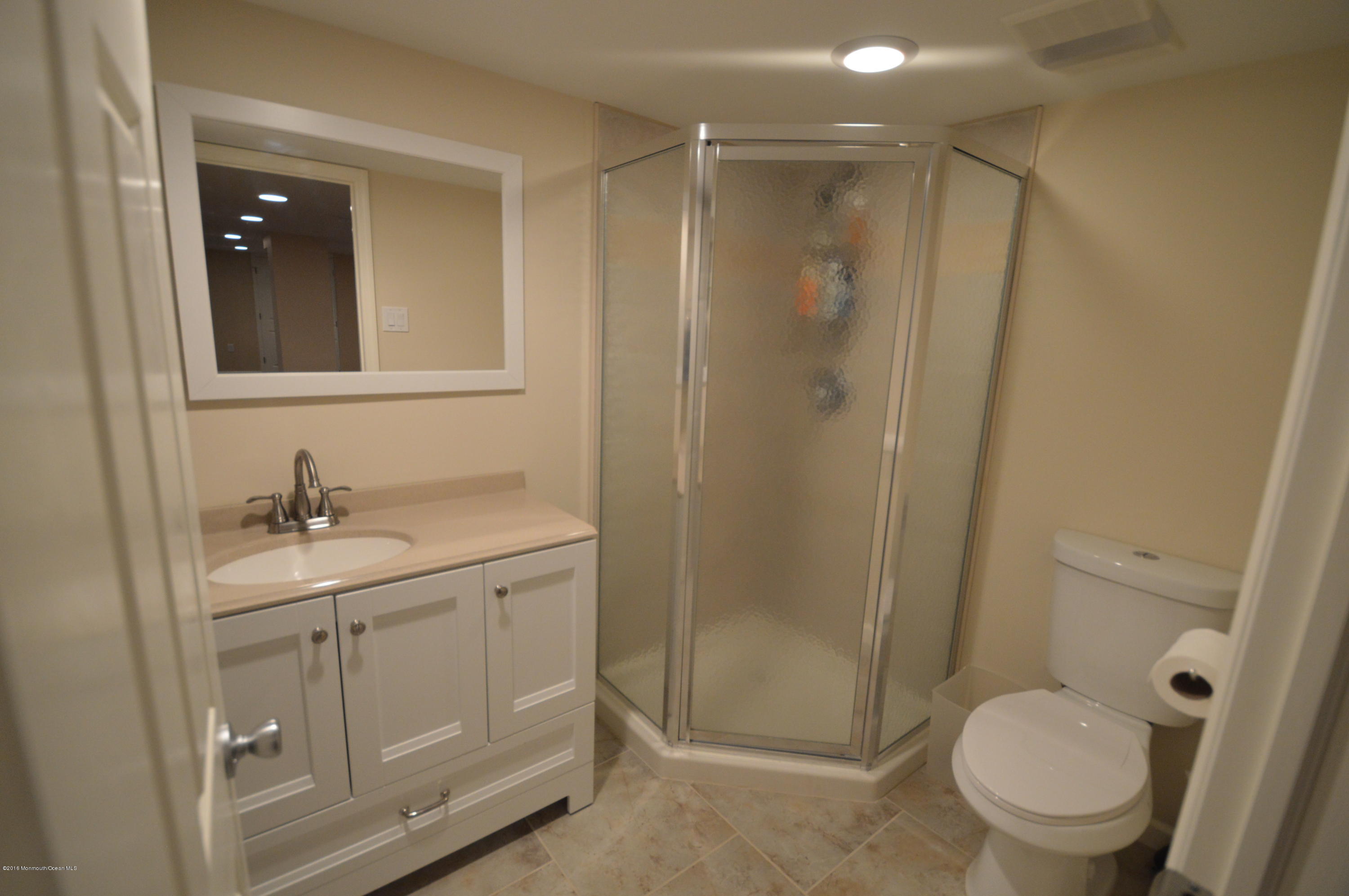 260 Adelphia Road Farmingdale, NJ 07727 - Photo 27 of 30 a bathroom with a granite countertop sink toilet and shower