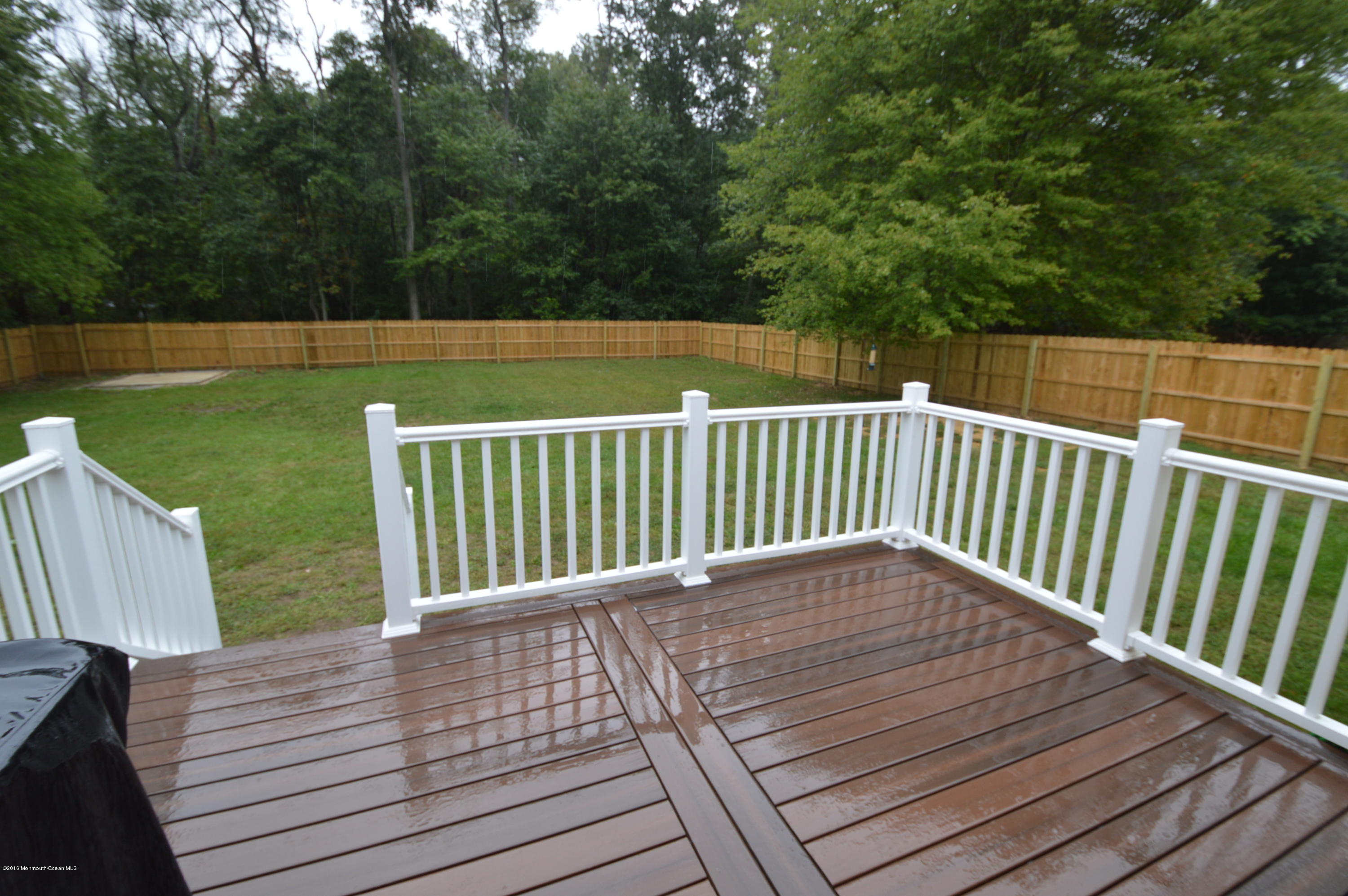260 Adelphia Road Farmingdale, NJ 07727 - Photo 30 of 30 a view of deck and deck with trees