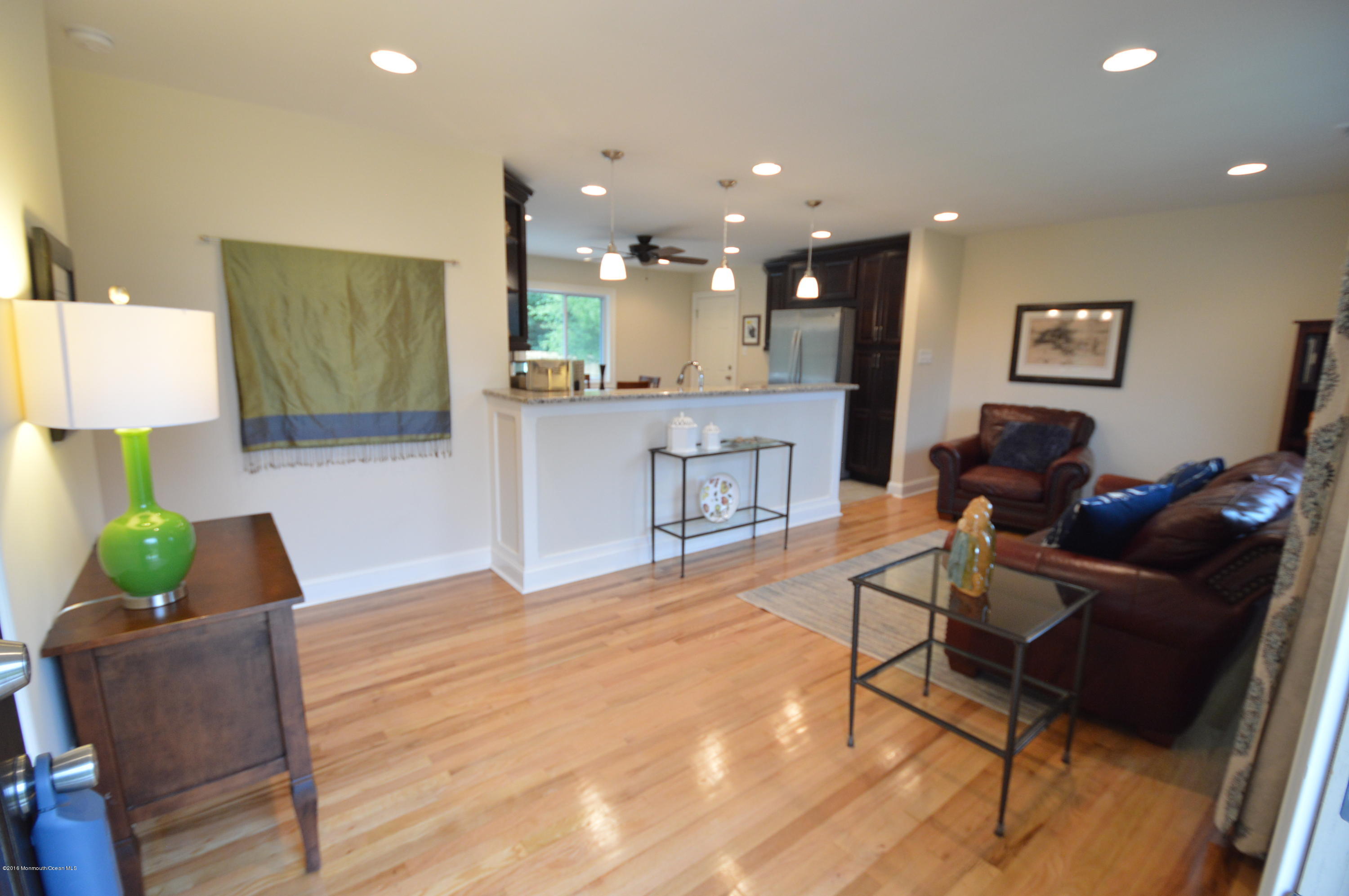 260 Adelphia Road Farmingdale, NJ 07727 - Photo 4 of 30 a living room with furniture and a wooden floor