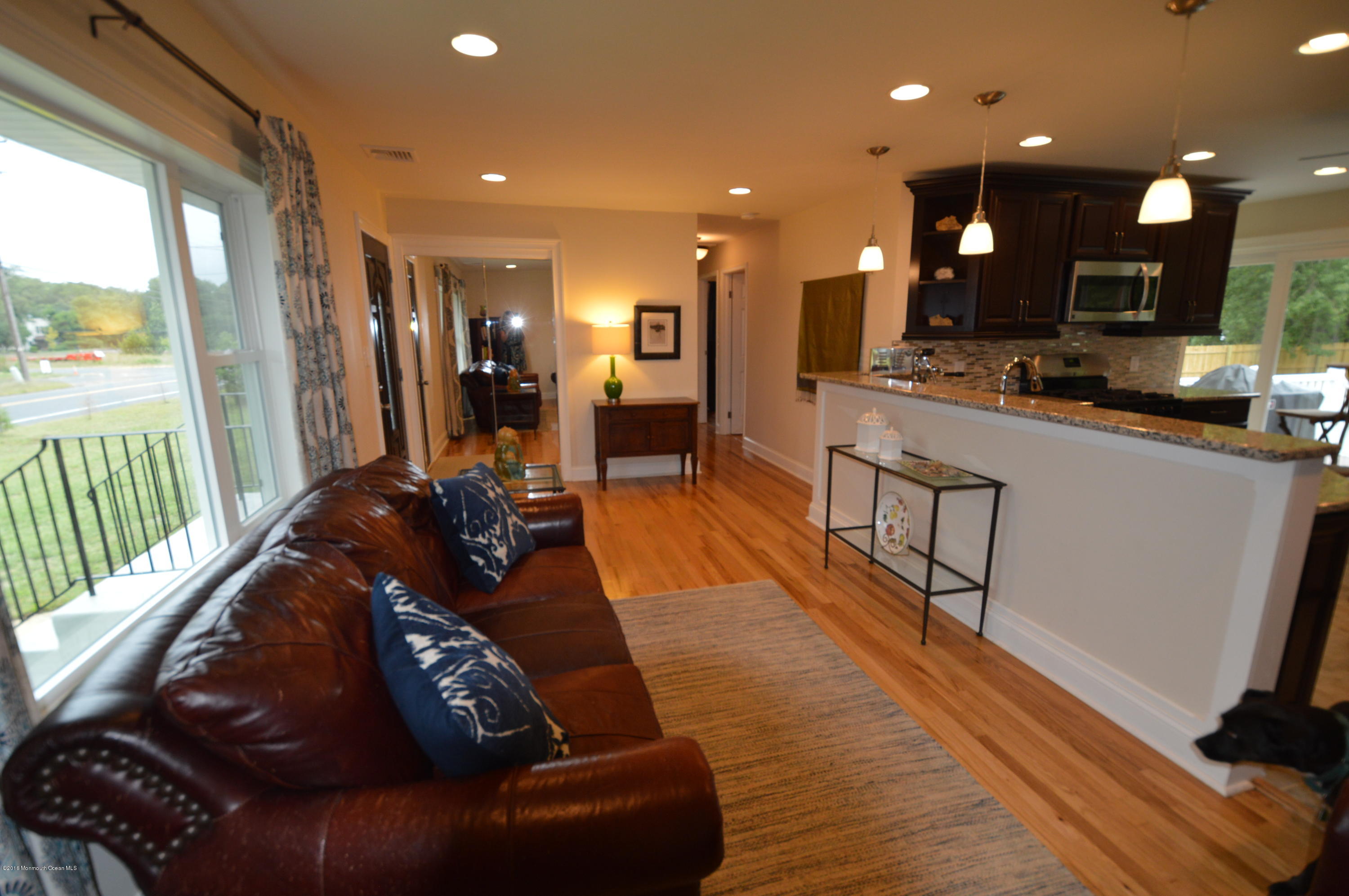 260 Adelphia Road Farmingdale, NJ 07727 - Photo 5 of 30 a living room with furniture and a wooden floor