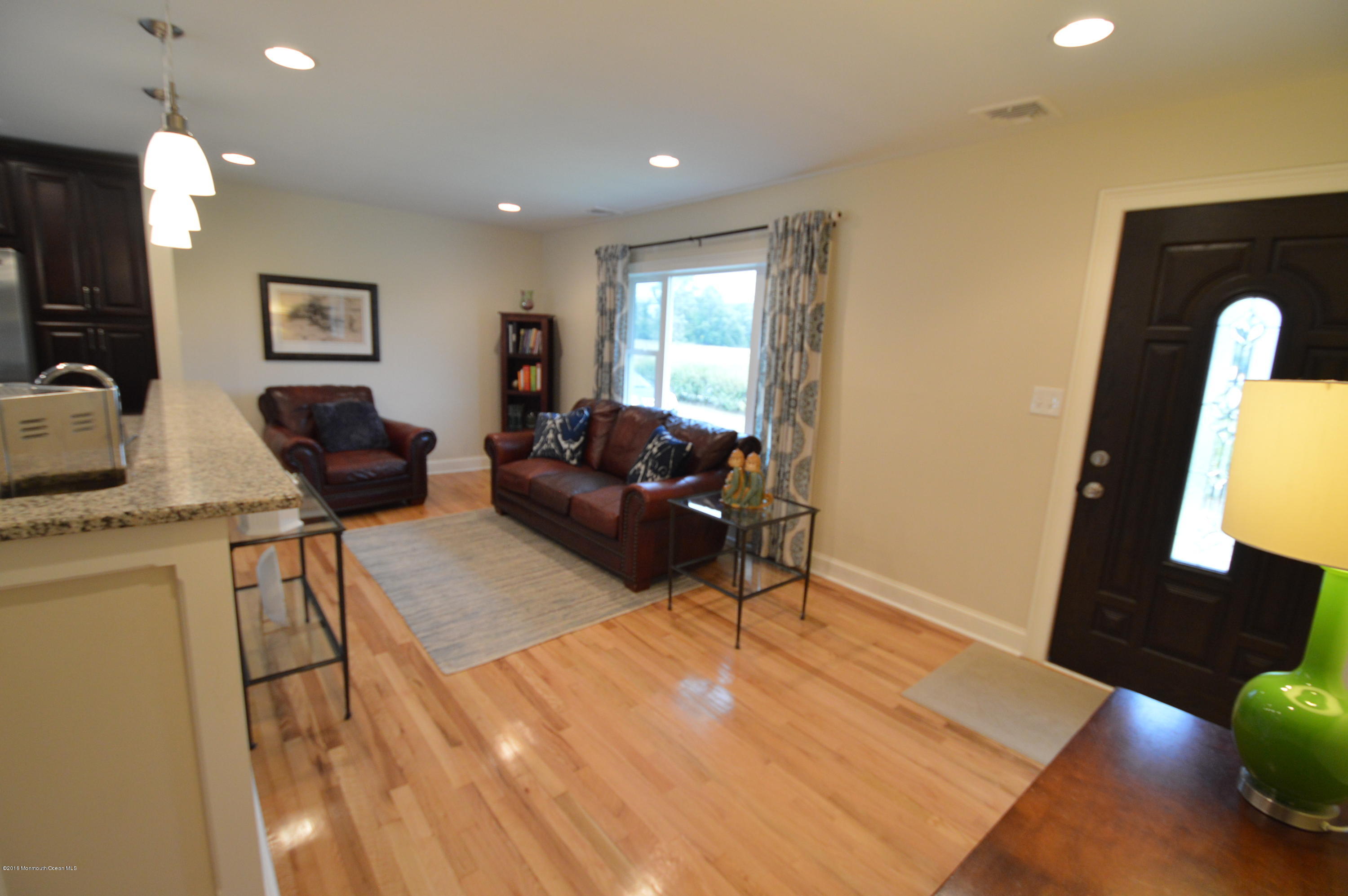 260 Adelphia Road Farmingdale, NJ 07727 - Photo 6 of 30 a living room with furniture and a flat screen tv