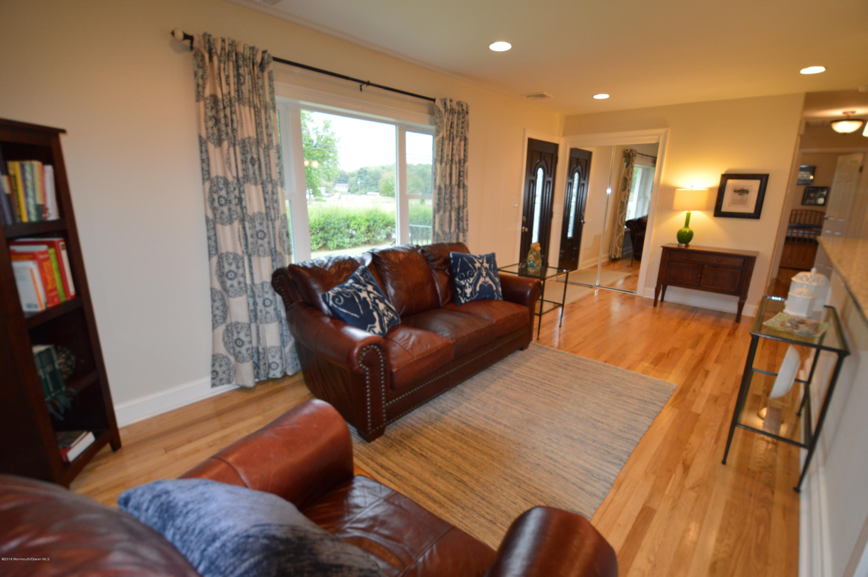 260 Adelphia Road Farmingdale, NJ 07727 - Photo 7 of 30 a living room with furniture and a flat screen tv