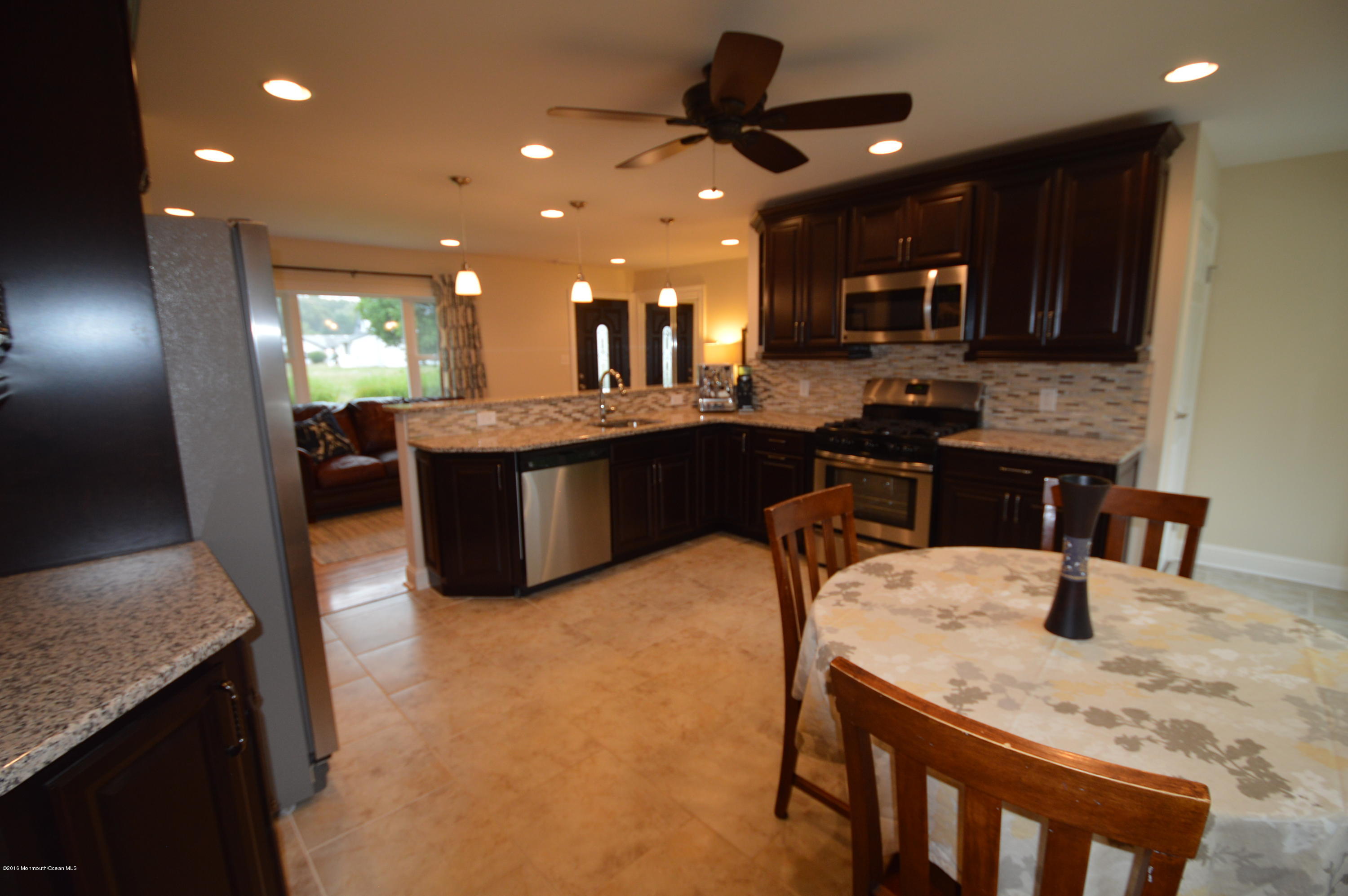 260 Adelphia Road Farmingdale, NJ 07727 - Photo 10 of 30 a dining hall with stainless steel appliances granite countertop a sink and a refrigerator