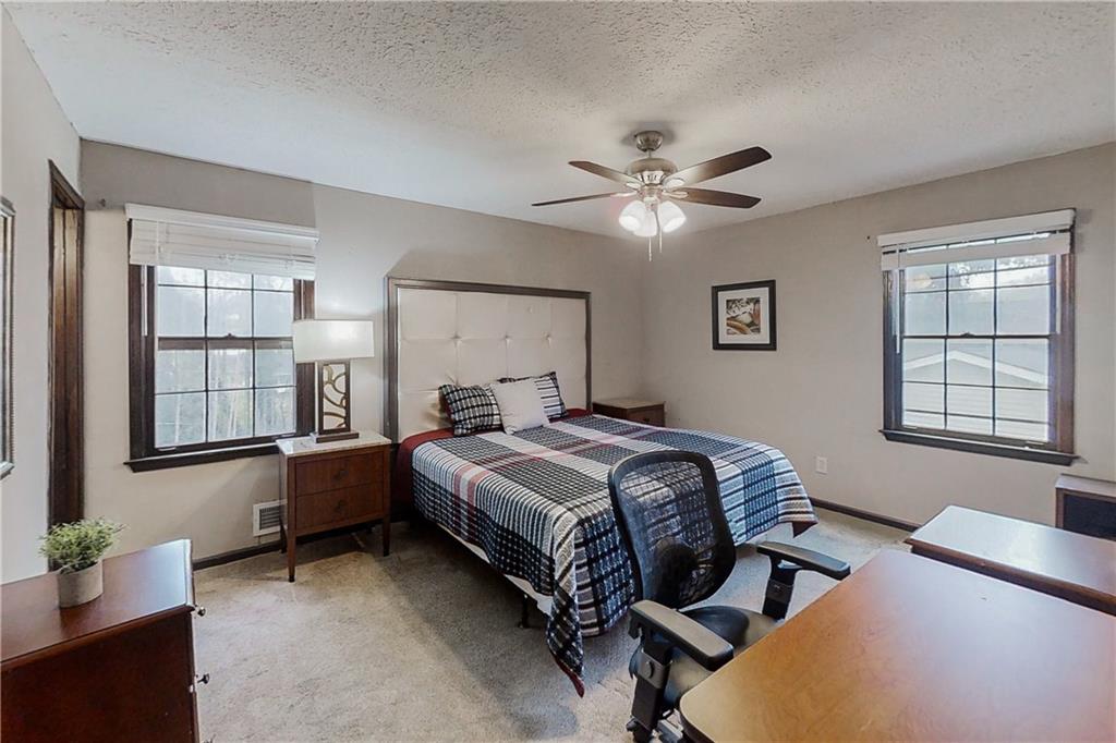 2284 Emerald Springs Drive Decatur, GA 30035 - Photo 17 of 30 a spacious bedroom with two beds and a window