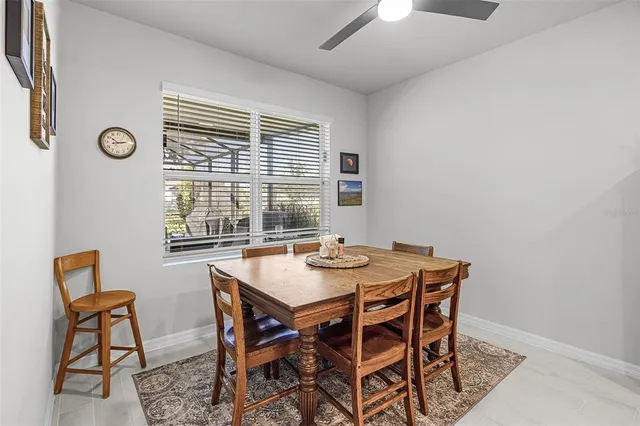 a view of a dining room with furniture and window