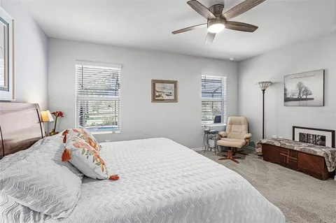 a bedroom with two beds and a couch