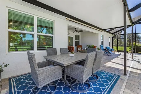 a view of a dining room with furniture wooden floor and a rug