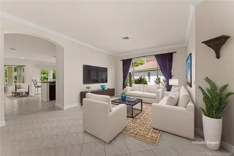 a kitchen with stainless steel appliances granite countertop a sink and a refrigerator
