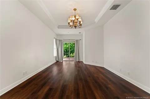 an aerial view of a house with a lake view