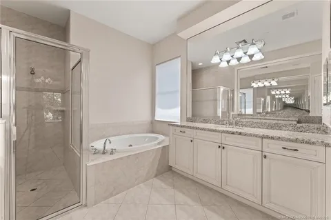 a view of a swimming pool and trees in the background