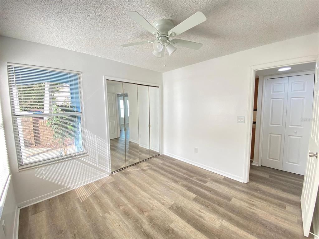 2751 North Poinciana Boulevard, Unit 27 Kissimmee, FL 34746 - Photo 13 of 18 a view of an empty room with a window