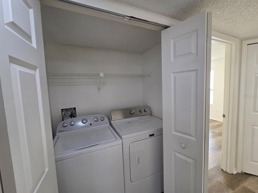 2751 North Poinciana Boulevard, Unit 27 Kissimmee, FL 34746 - Photo 15 of 18 a utility room with dryer and washer