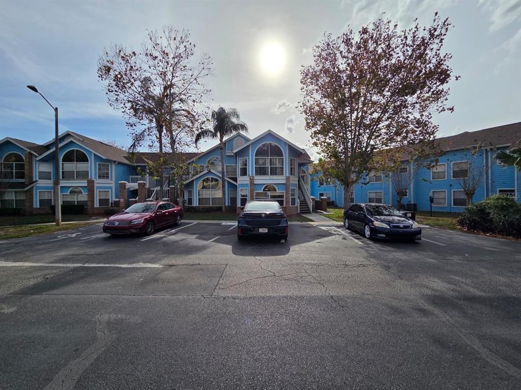 2751 North Poinciana Boulevard, Unit 27 Kissimmee, FL 34746 - Photo 2 of 18 a car parked in front of a house