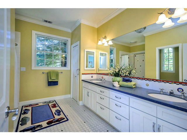 500 Pullman Road Hillsborough, CA 94010 - Photo 14 of 20 a bathroom with a tub sink and mirror