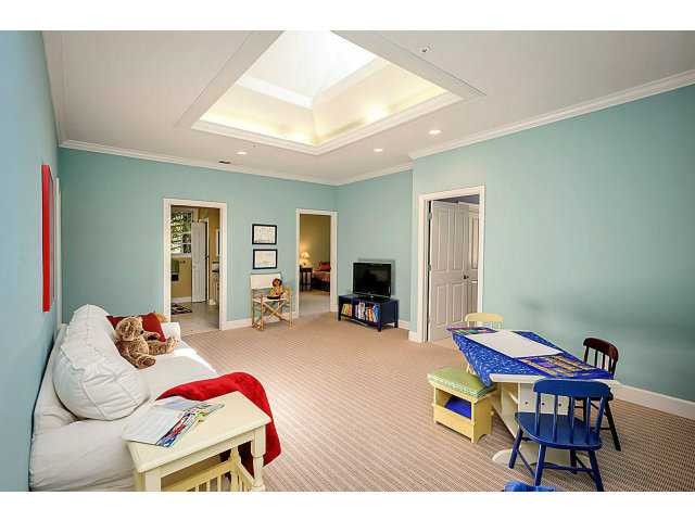 500 Pullman Road Hillsborough, CA 94010 - Photo 15 of 20 a living room with furniture a flat screen tv and a wooden floor